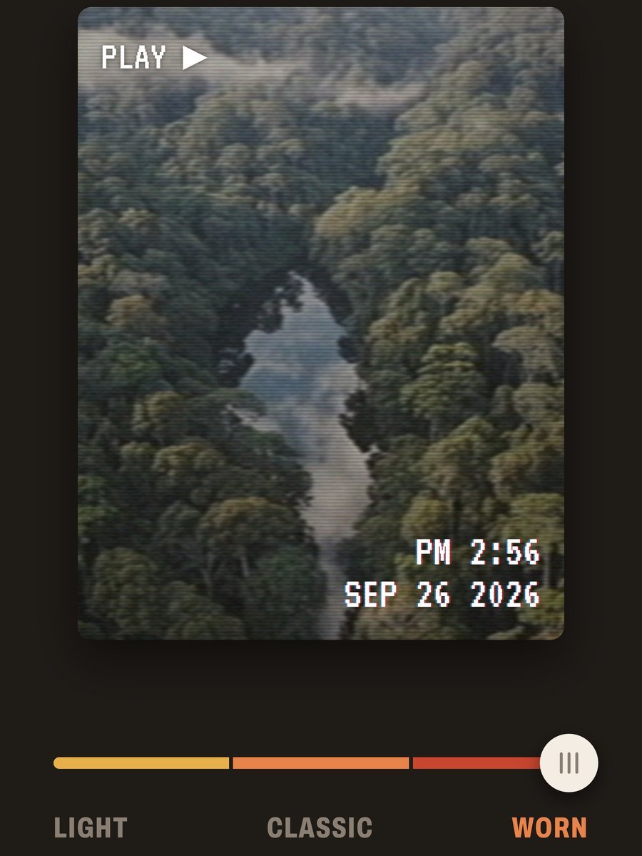 An aerial clip of a forest river with the Worn strength selected on the Light, Classic, Worn slider.
